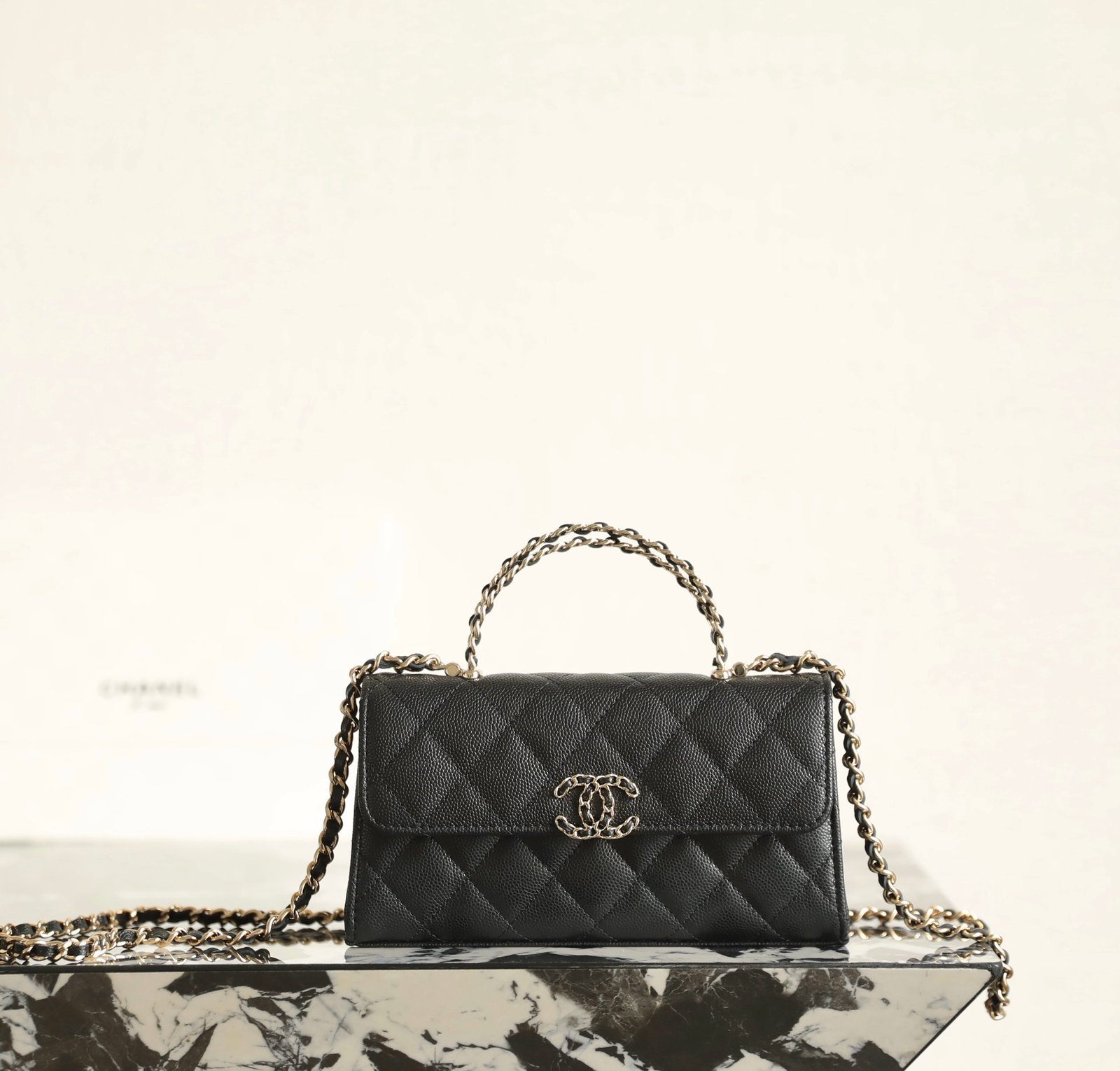 CHANEL Mini Kelly Crisscross Handle Flap Bag – Black Caviar with 14K Light Gold Hardware detail image 1 sourced from womanlvbag.com