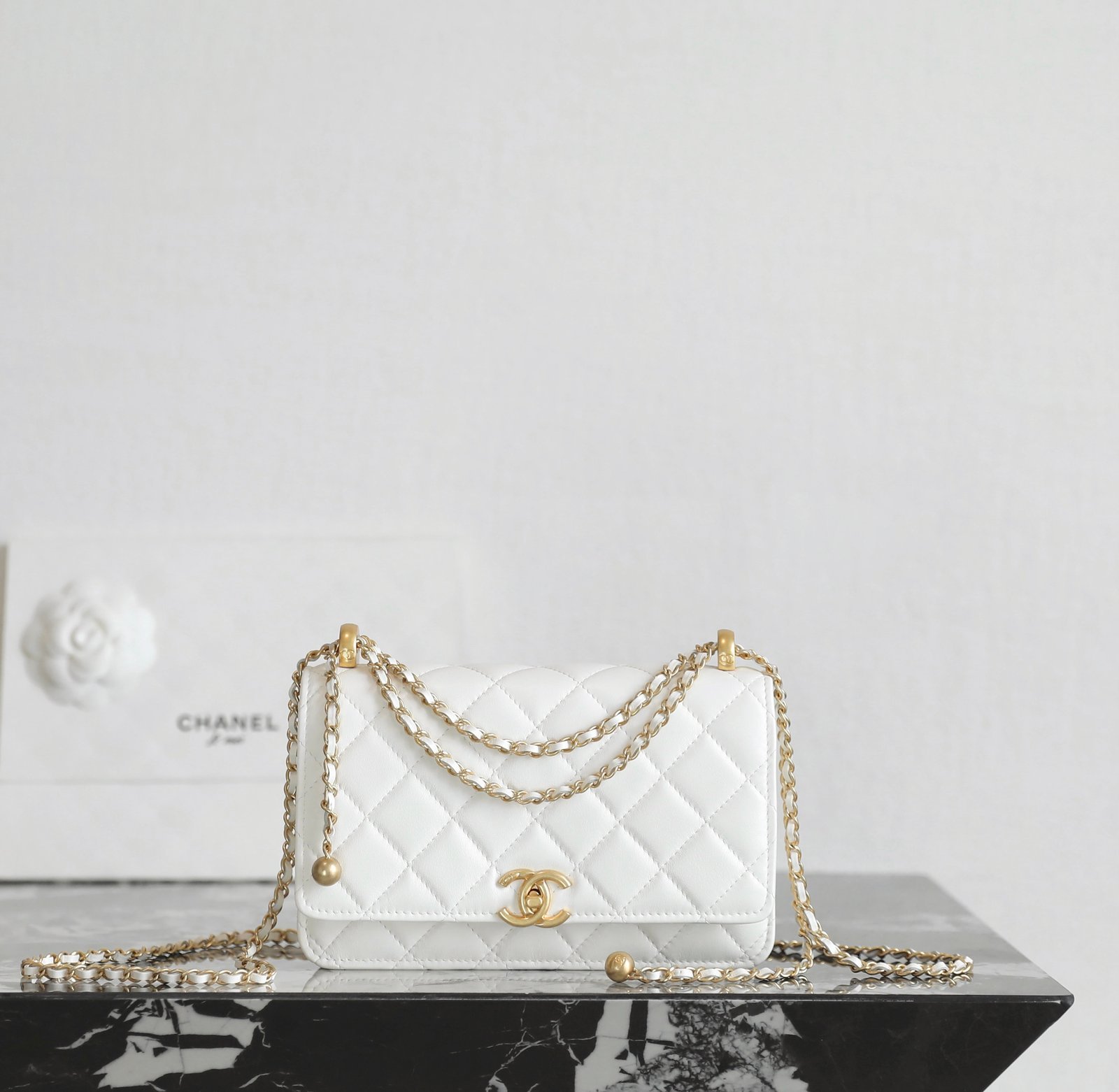 CHANEL Double Gold Ball Flap Wallet On Chain – White Calfskin with 24K Vintage Gold Hardware detail image 1 sourced from womanlvbag.com