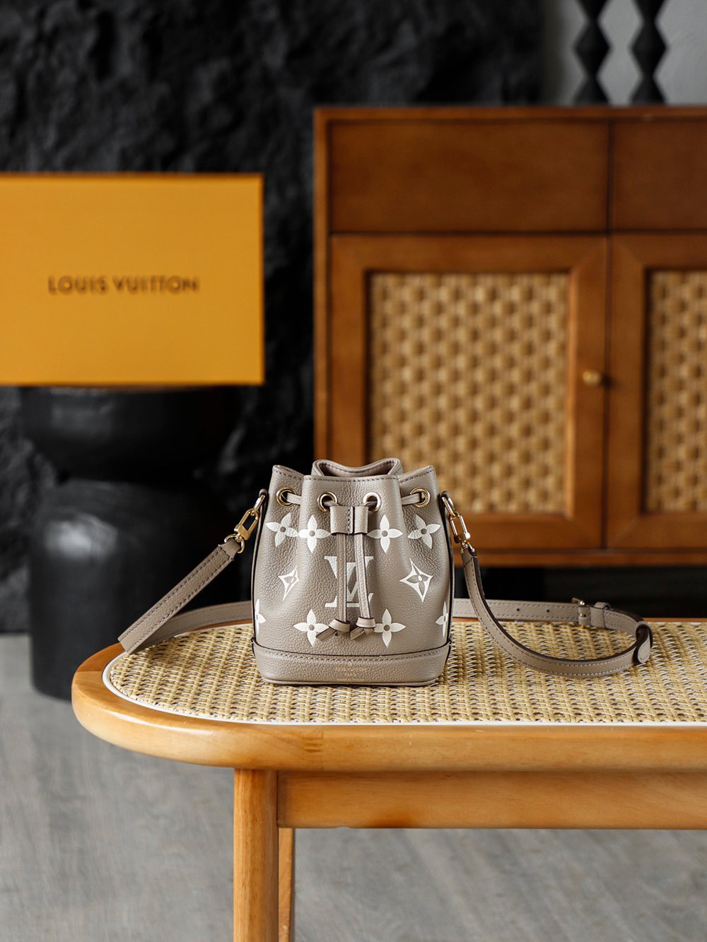 Louis Vuitton Nano Noé – Bicolor Monogram Empreinte in Tourterelle & Crème (M46291) detail image 1 sourced from womanlvbag.com