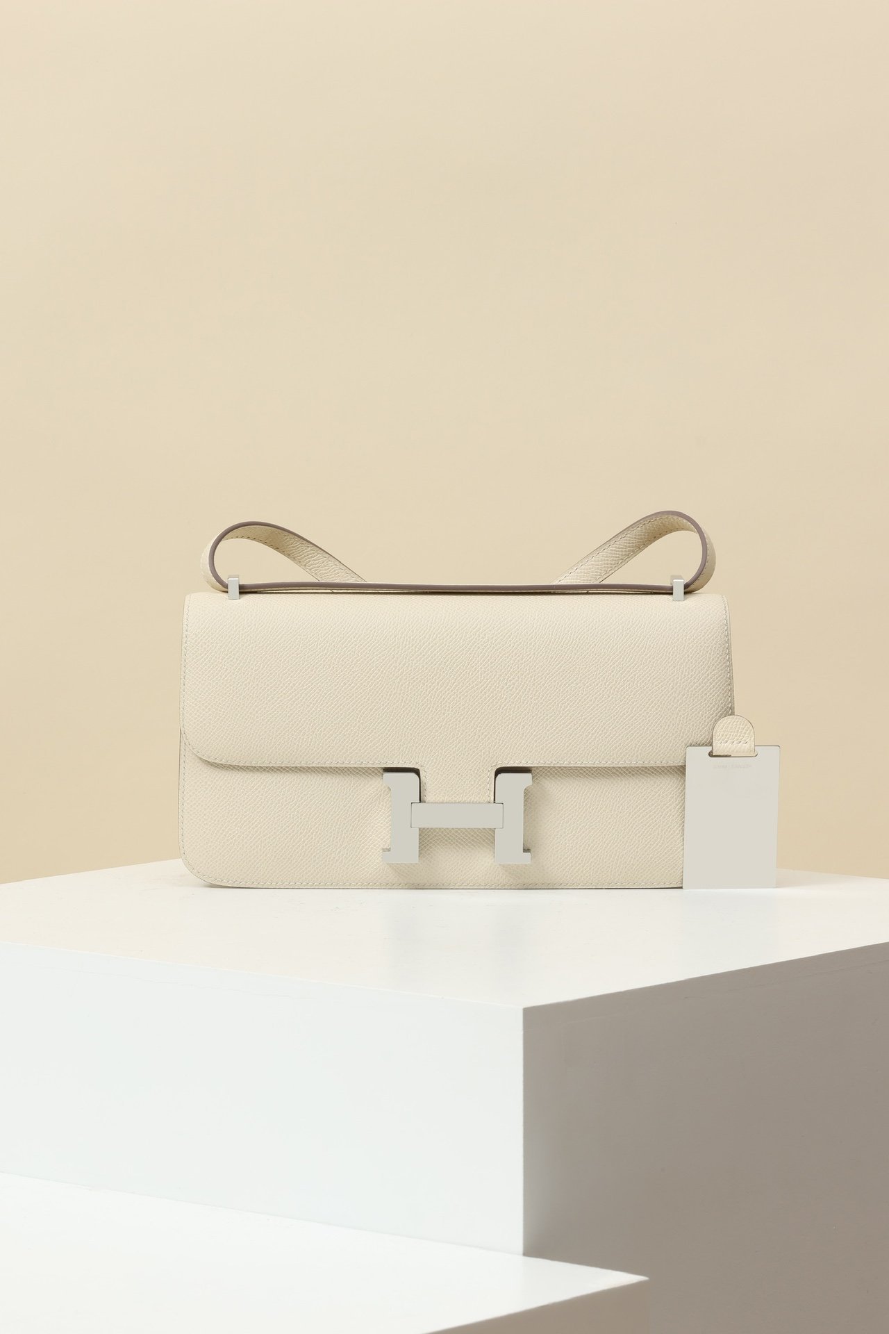 Hermès Constance Elan – Epsom Calfskin 10 Craie PHW detail image 1 sourced from womanlvbag.com