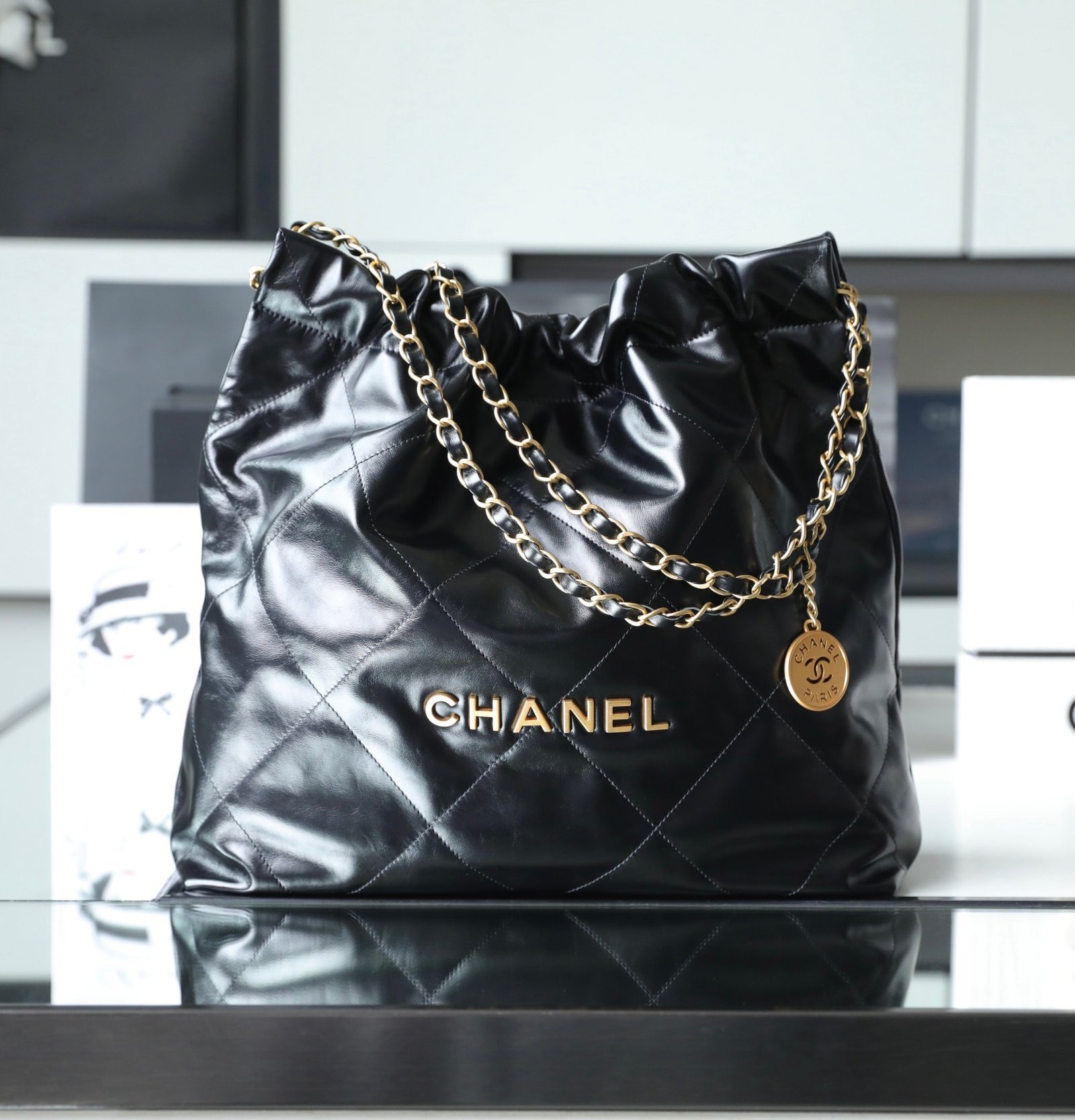CHANEL Medium 22 Bag – Black Shiny Calfskin Leather with 24K Vintage Gold Hardware detail image 1 sourced from womanlvbag.com