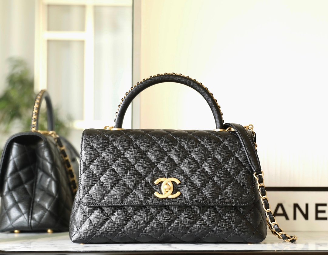 CHANEL Medium Coco Handle Bag – Black Caviar Leather with Chain-Wrapped Handle & 24K Vintage Gold Hardware detail image 1 sourced from womanlvbag.com