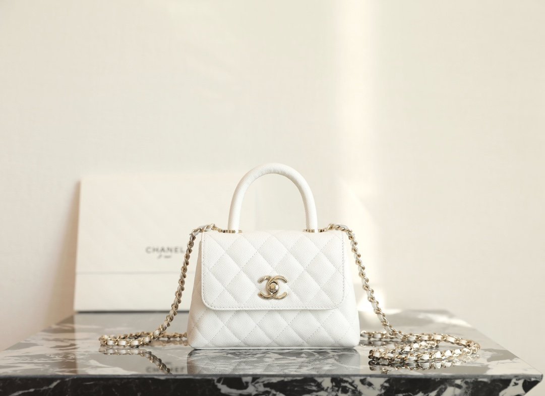CHANEL Mini Coco Handle Bag – White Caviar Leather with 14K Light Gold Hardware detail image 1 sourced from womanlvbag.com