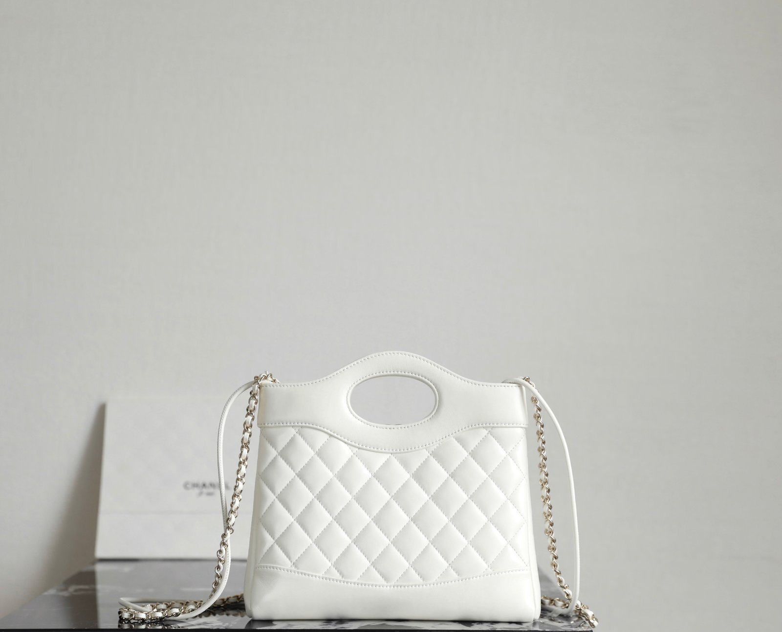 CHANEL 31 Nano Shopping Bag – White Lambskin with 14K Light Gold Hardware detail image 2 sourced from womanlvbag.com