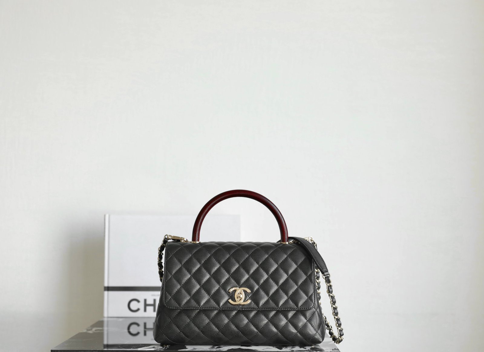 CHANEL Medium Coco Handle Bag – Black Caviar Leather with Burgundy Lizard-Embossed Handle & 14K Light Gold Hardware detail image 1 sourced from womanlvbag.com