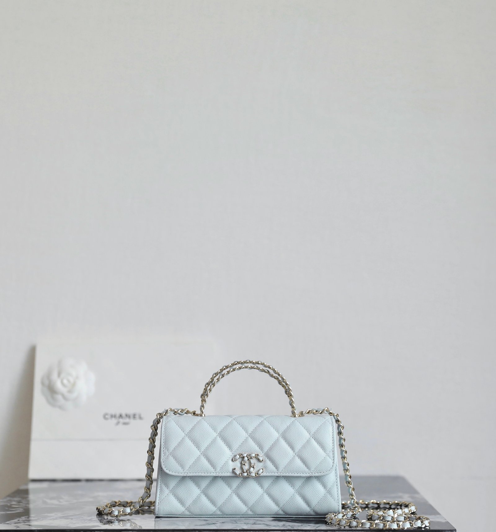 CHANEL Mini Kelly Crisscross Handle Chain Bag – Light Blue Caviar with 14K Light Gold Hardware detail image 2 sourced from womanlvbag.com