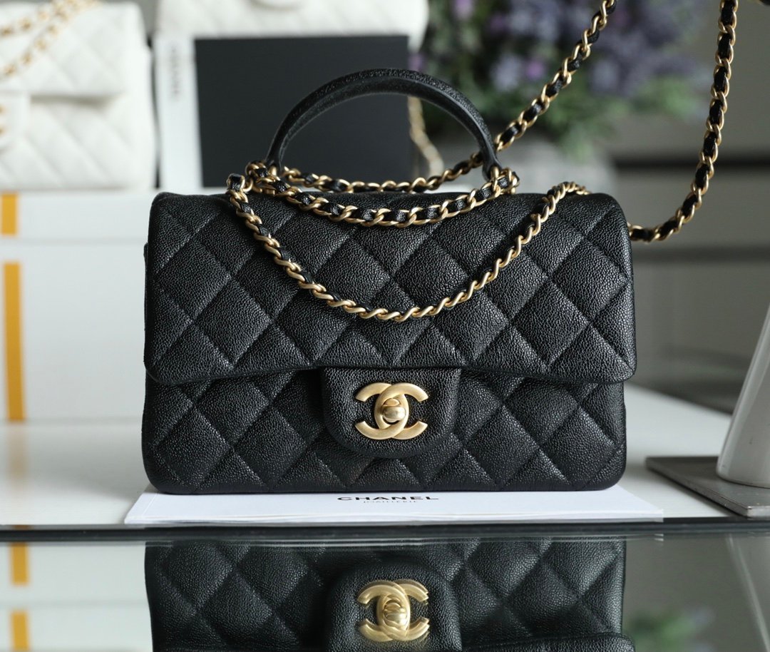 CHANEL Mini Flap Bag with Top Handle – Black Caviar with 24K Vintage Gold Hardware detail image 1 sourced from womanlvbag.com