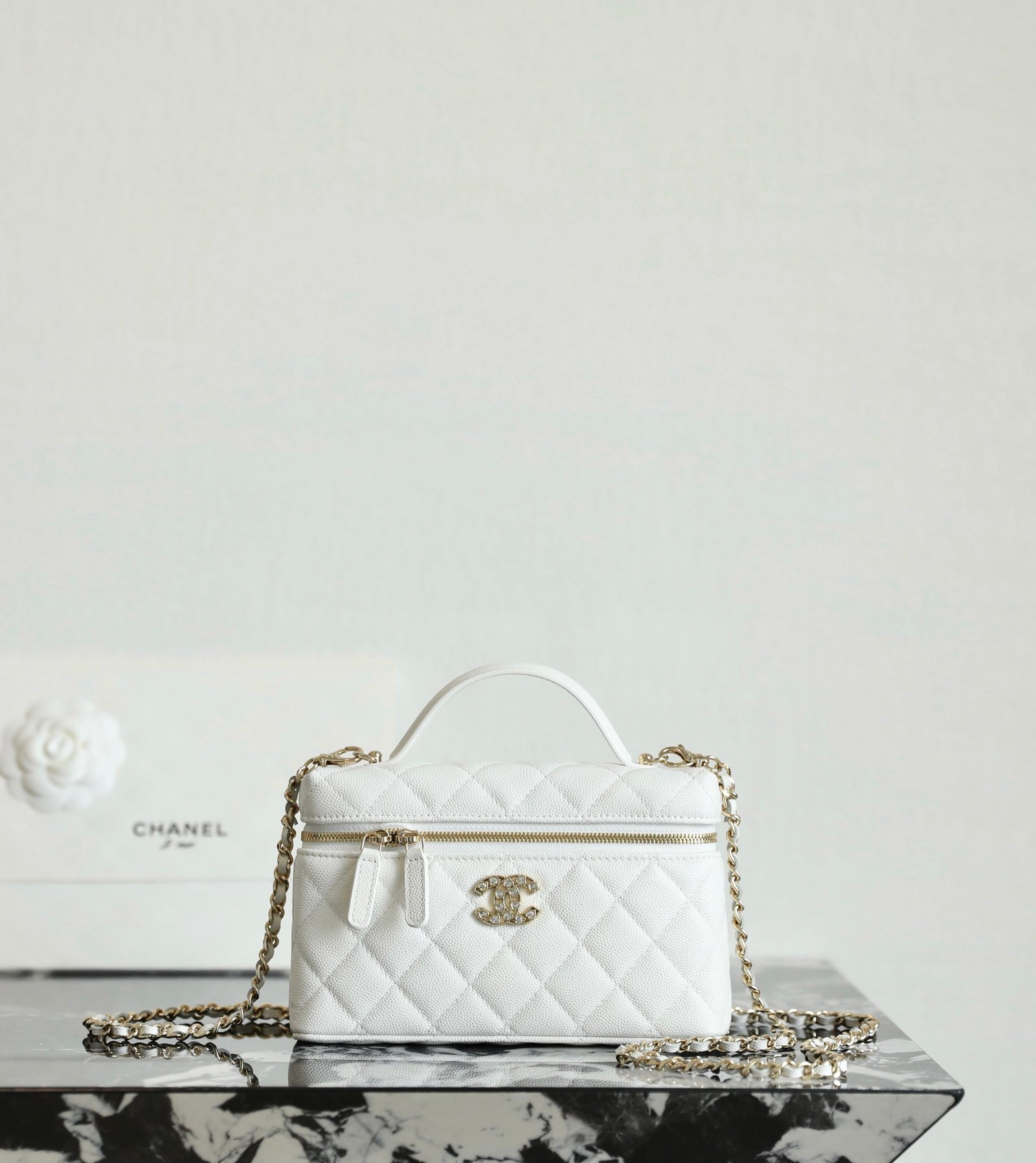 CHANEL Vanity Case with Chain – White Caviar Leather with 14K Light Gold Heart-Crystal Hardware detail image 1 sourced from womanlvbag.com