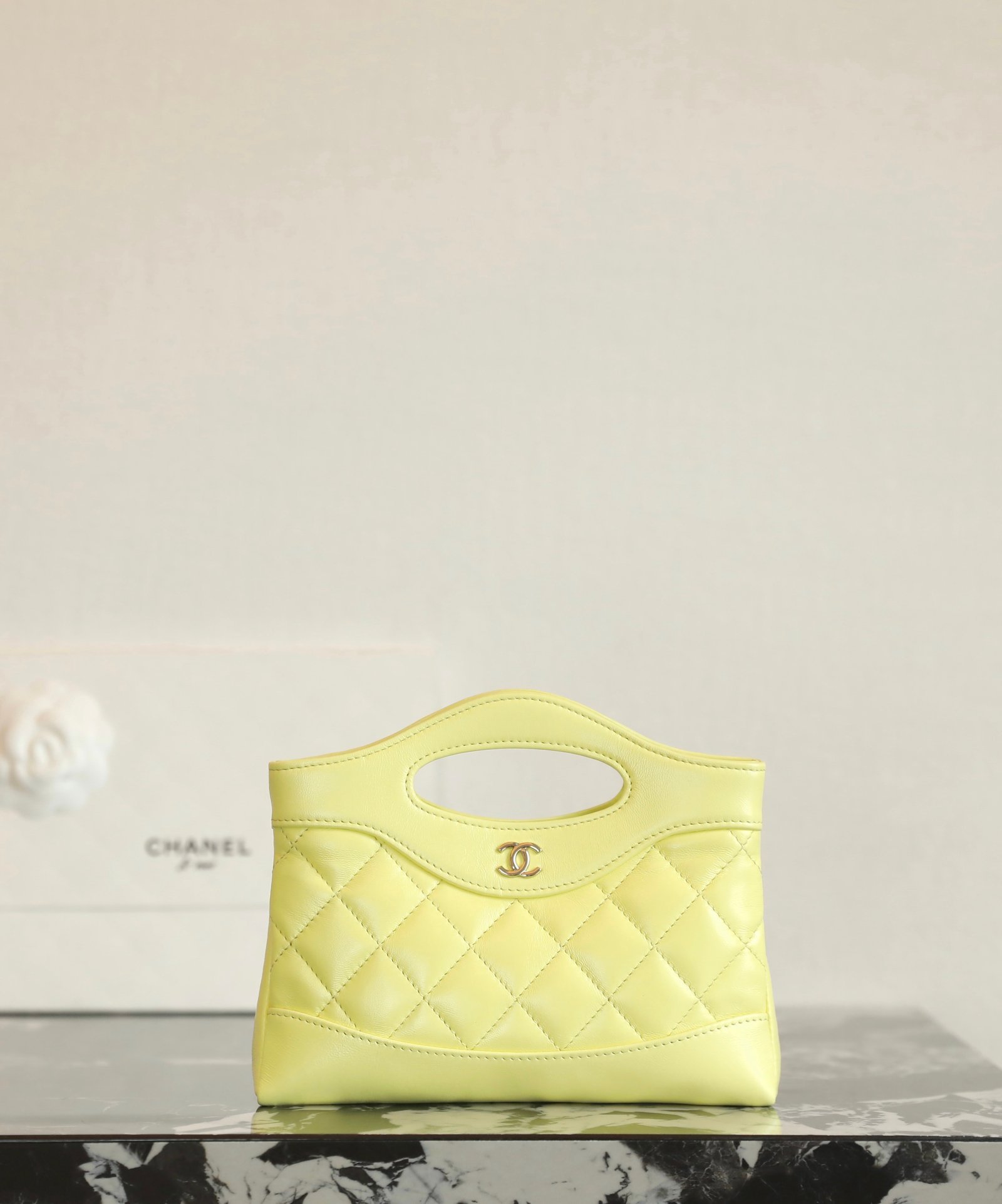 CHANEL 31 Nano Shopping Bag – Vibrant Yellow Shiny Lambskin with 14K Light Gold Hardware detail image 1 sourced from womanlvbag.com