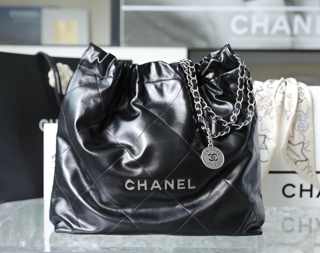 CHANEL Medium 22 Bag – Black Shiny Calfskin Leather with Antique Silver-Tone Hardware detail image 1 sourced from womanlvbag.com
