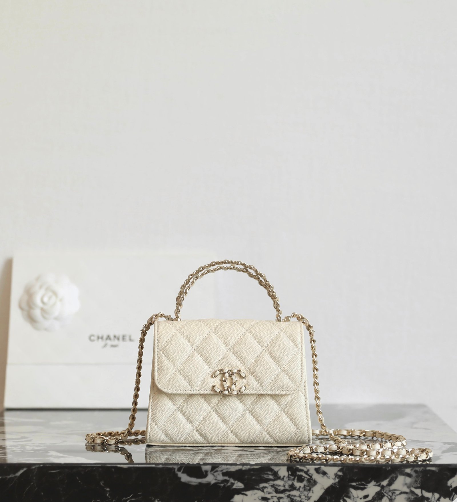 CHANEL Mini Small Kelly Crisscross Handle Flap Bag – Light Beige Caviar with 14K Light Gold Hardware detail image 1 sourced from womanlvbag.com