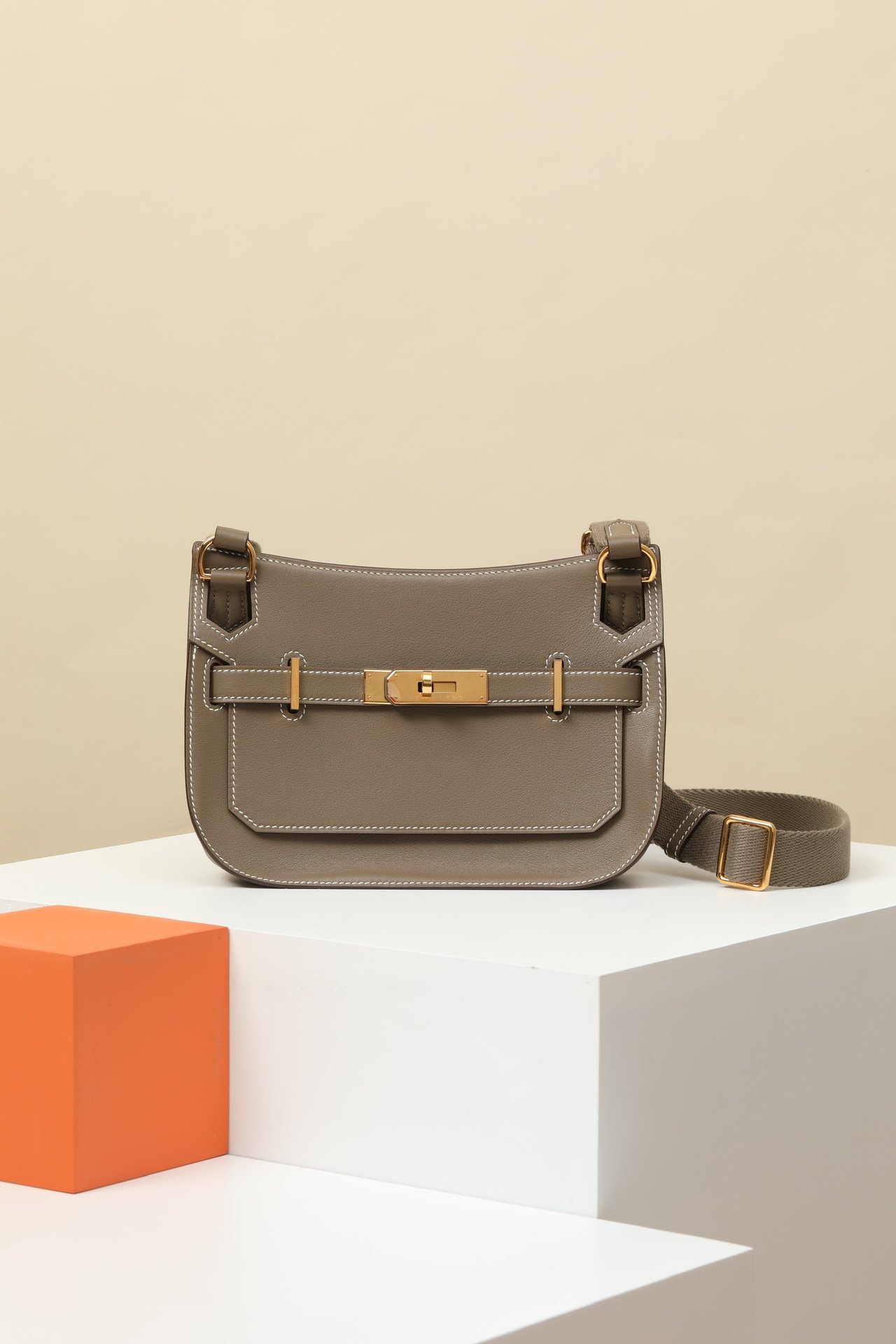 Hermès Mini Jypsière – Swift Calfskin CK18 Etoupe GHW comparison image 2 sourced from womanlvbag.com