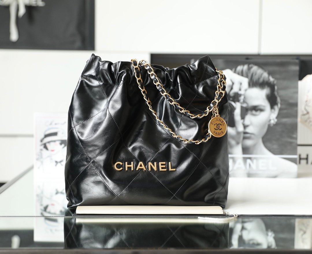 CHANEL Small 22 Bag – Black Shiny Calfskin Leather with 24K Vintage Gold Hardware detail image 1 sourced from womanlvbag.com