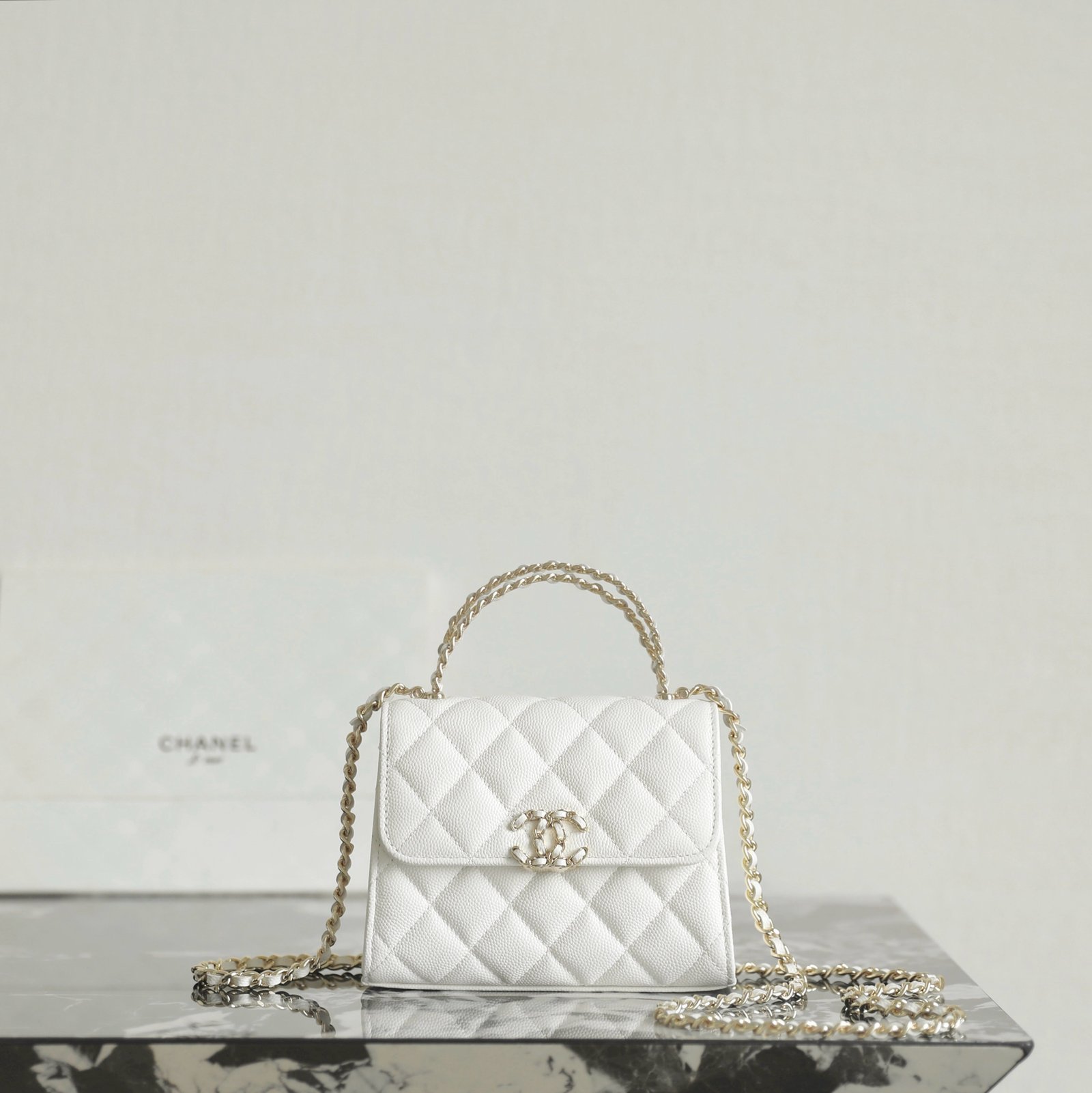 CHANEL Mini Small Kelly Crisscross Handle Flap Bag – White Caviar with 14K Light Gold Hardware detail image 1 sourced from womanlvbag.com