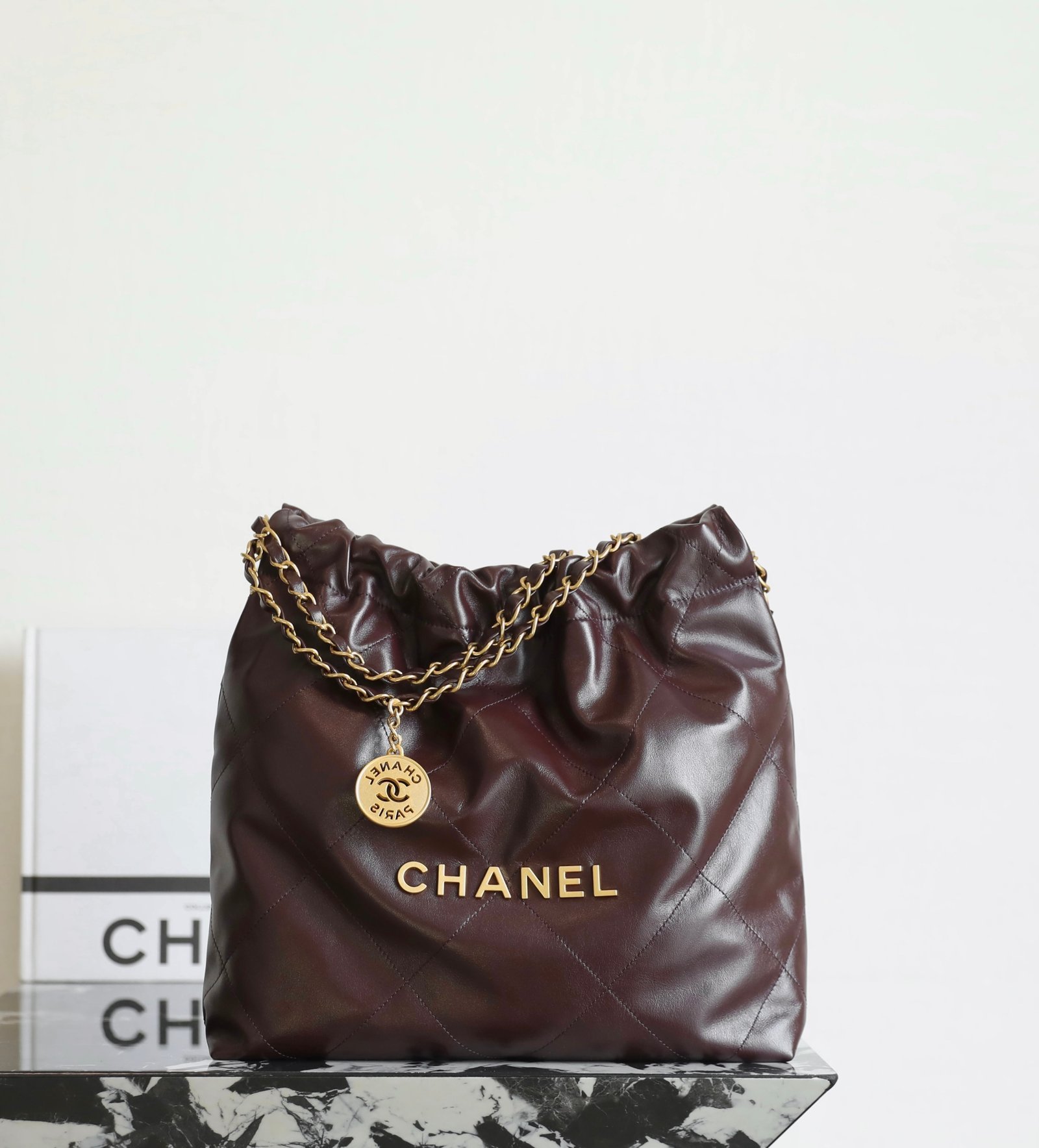 CHANEL Small 22 Bag – Chocolate Brown Calfskin Leather with 24K Vintage Gold Hardware detail image 1 sourced from womanlvbag.com