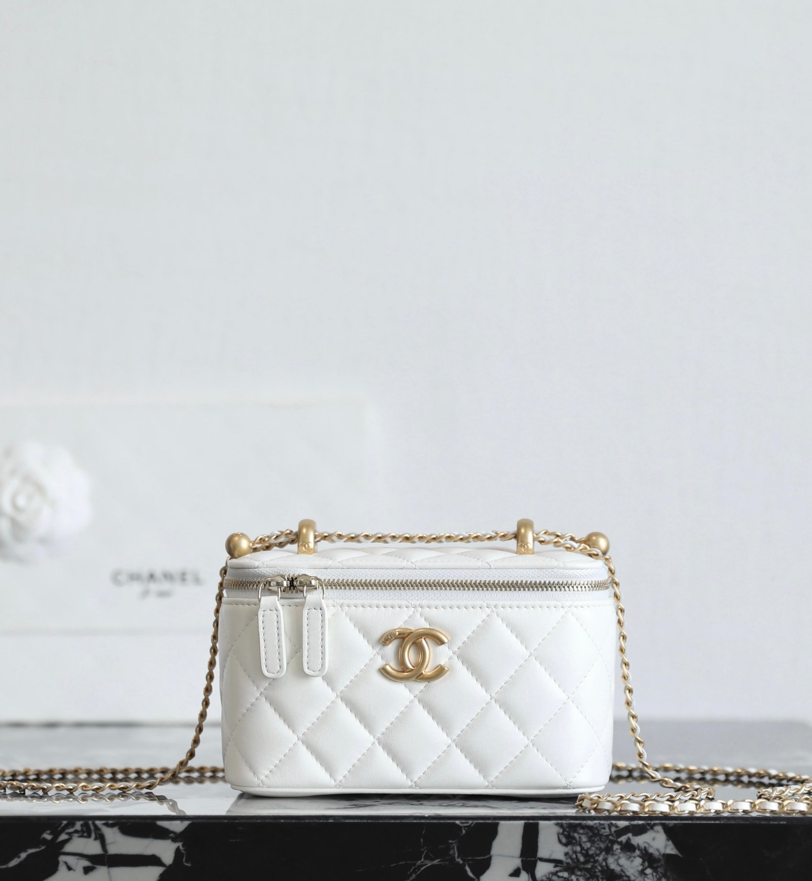 CHANEL Vanity with Double Chain & Golden Ball – White Calfskin & 24K Vintage Gold detail image 1 sourced from womanlvbag.com