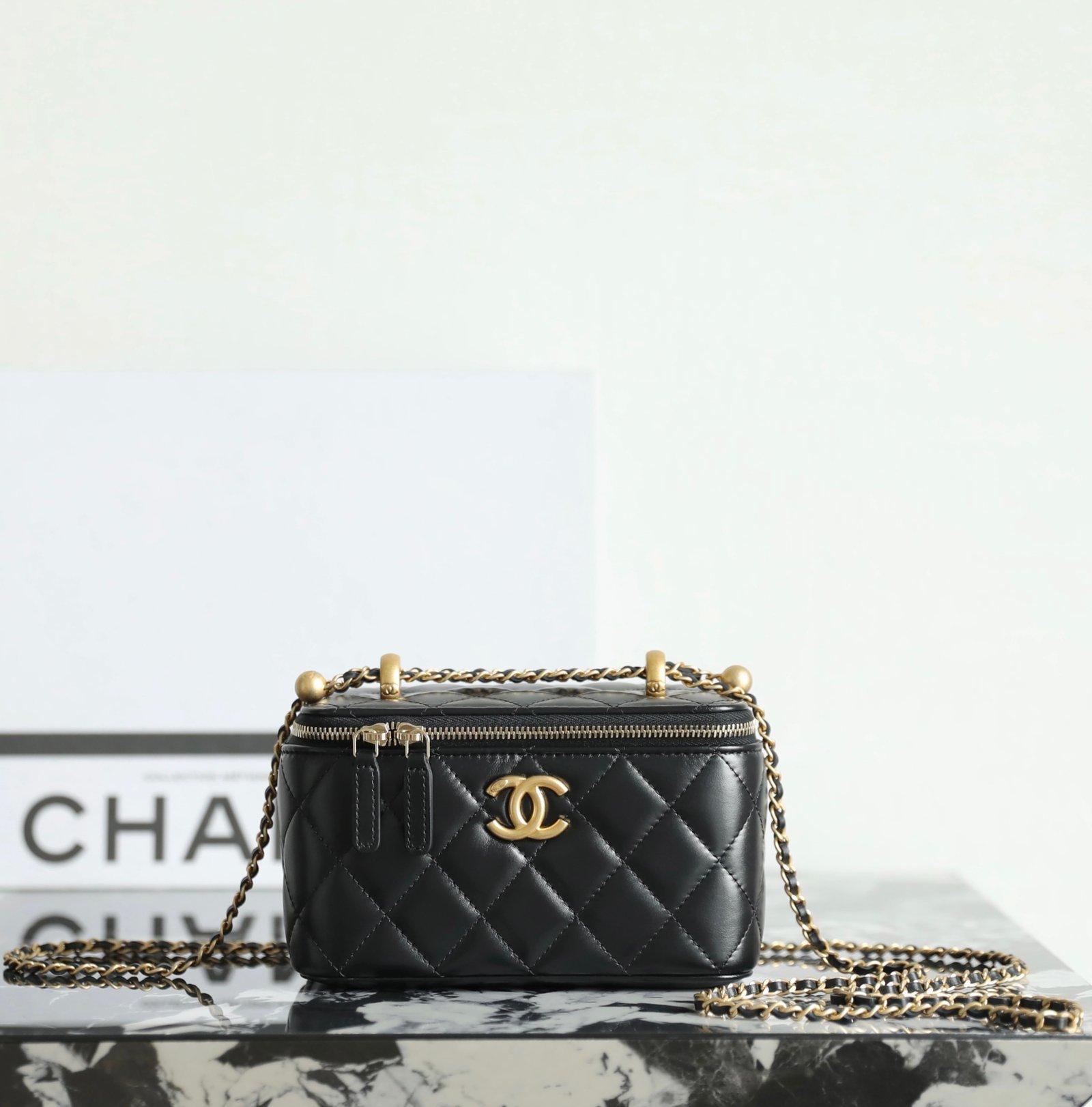 CHANEL Vanity with Double Chain & Golden Ball – Black Calfskin & 24K Vintage Gold detail image 1 sourced from womanlvbag.com