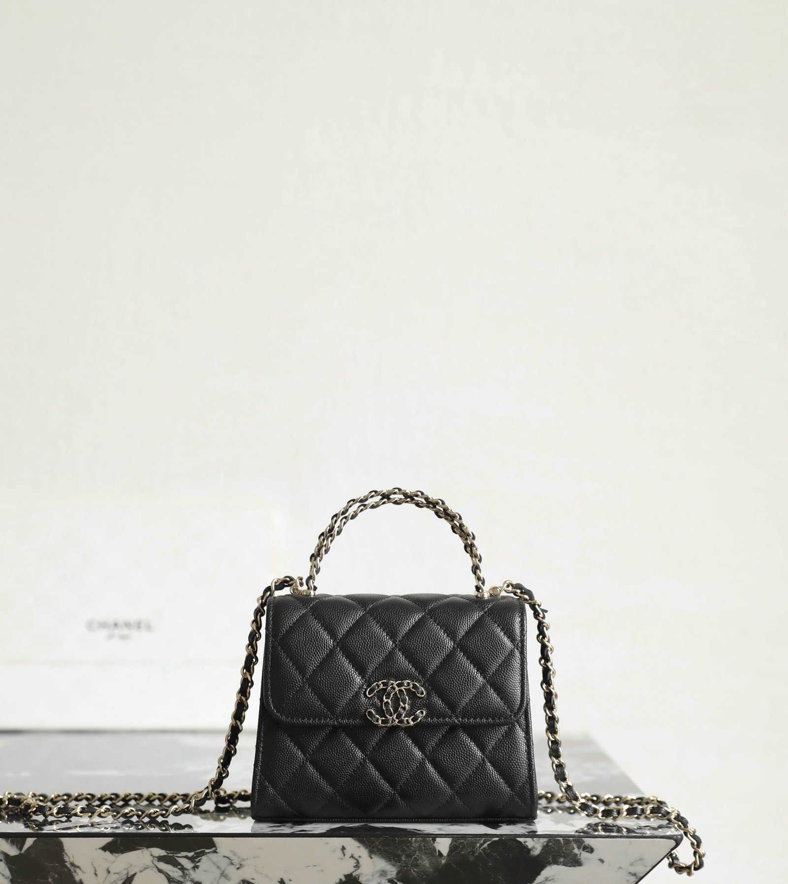 CHANEL Mini Small Kelly Crisscross Handle Flap Bag – Black Caviar with 14K Light Gold Hardware detail image 1 sourced from womanlvbag.com