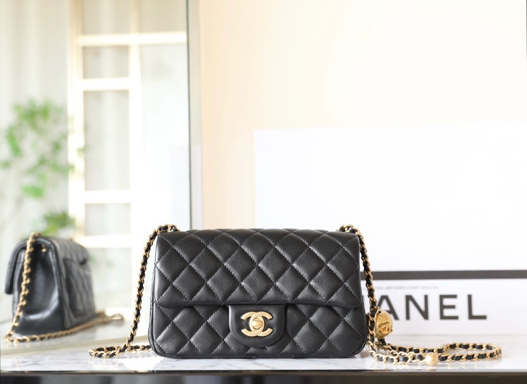 CHANEL Large Mini "Golden Ball" Adjustable Flap Bag – Black Lambskin with 24K Vintage Gold Hardware detail image 1 sourced from womanlvbag.com