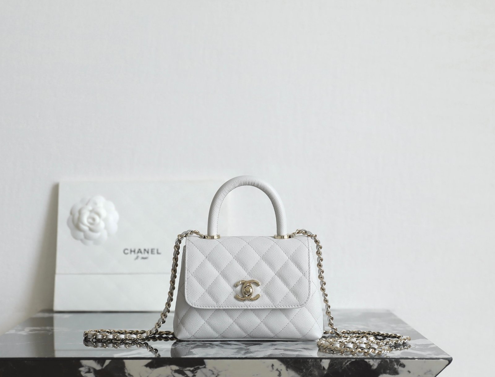 CHANEL Mini Coco Handle Bag – Light Grey Caviar Leather with 14K Light Gold Hardware detail image 1 sourced from womanlvbag.com